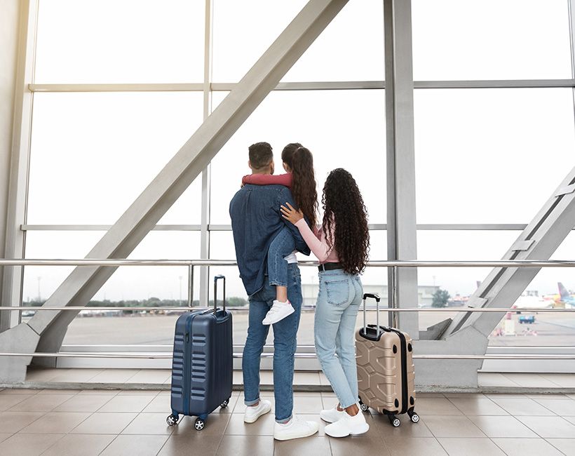 A family at the airport about to go on holiday